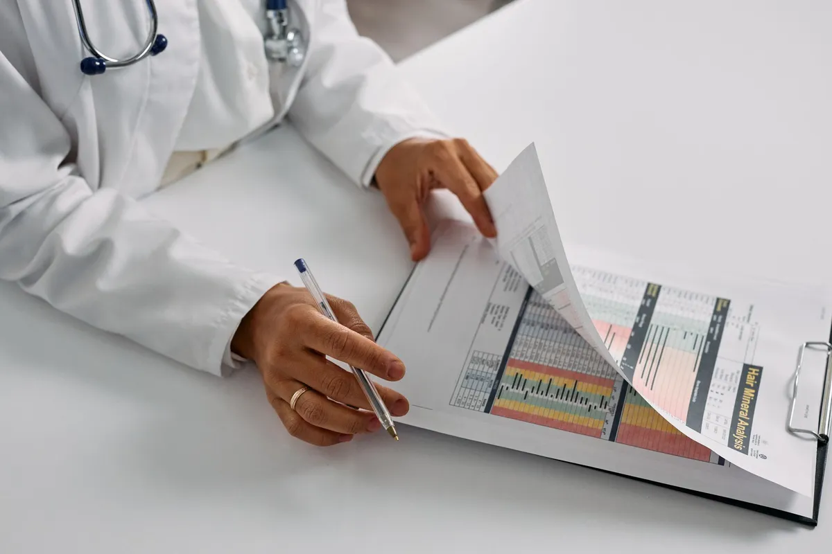Healthcare professional reviewing immunization records with a patient
