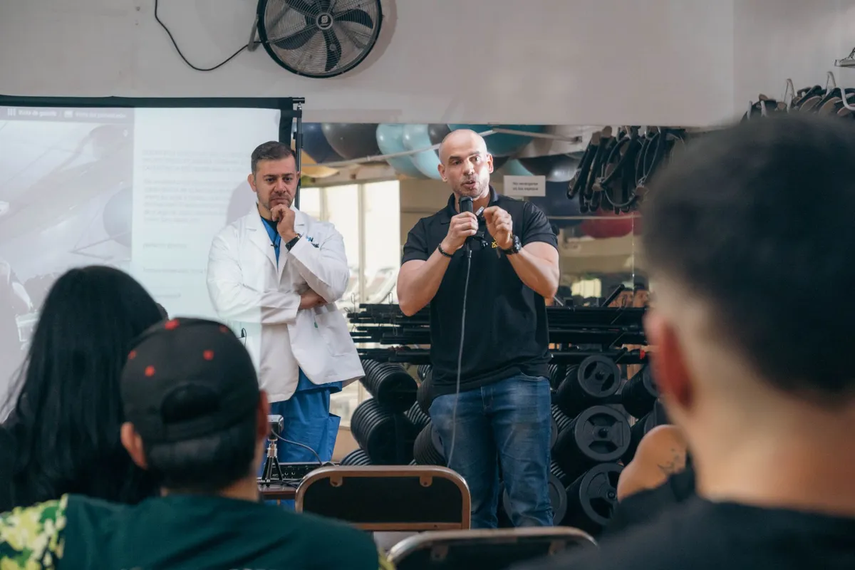 Two speakers discussing health topics at a community event with an audience.
