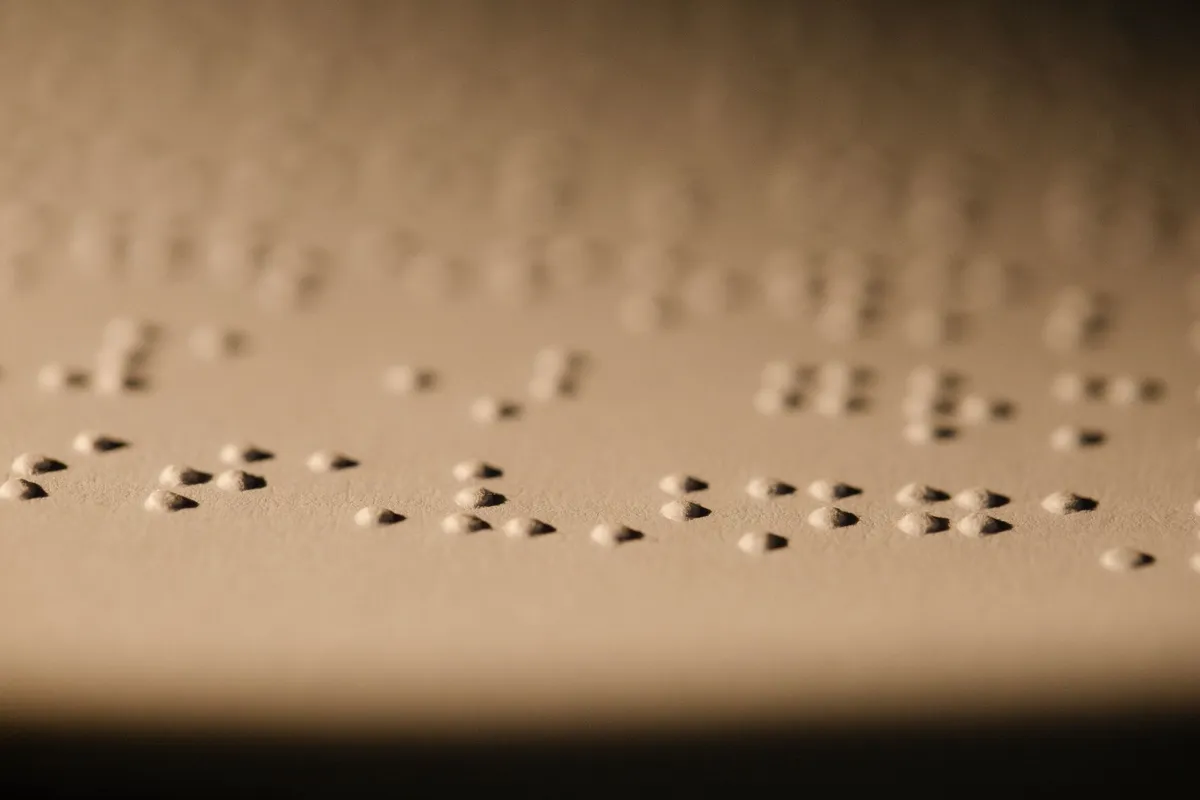 Close-up of raised braille dots on a page