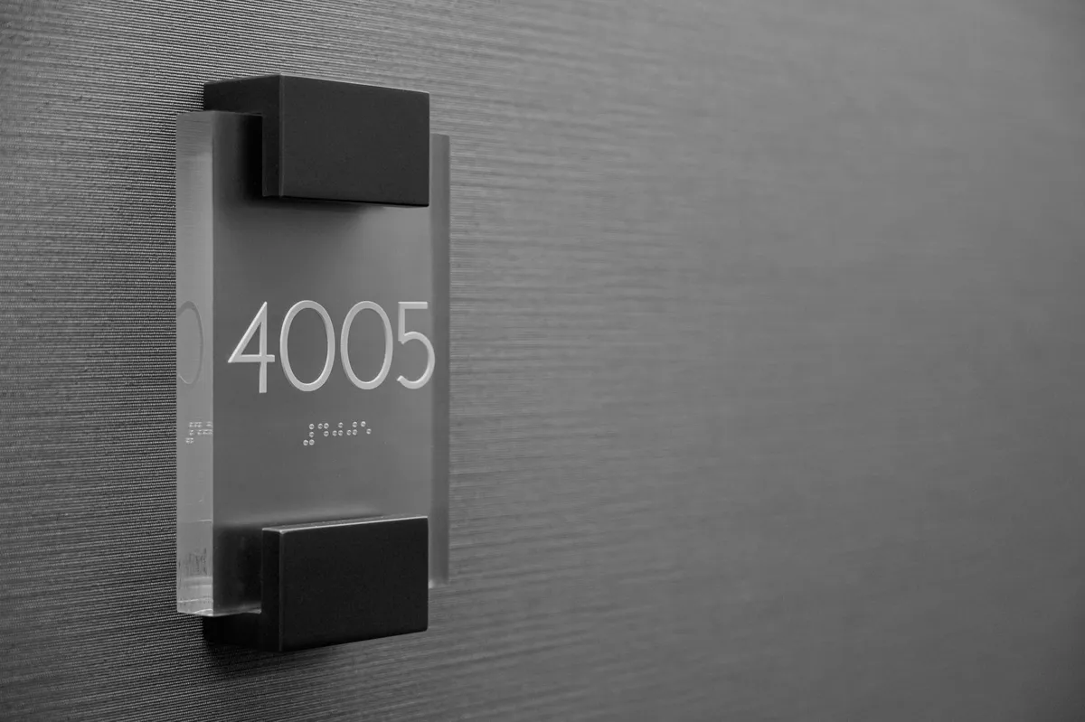 Braille signage with raised dots indicating room number 4005