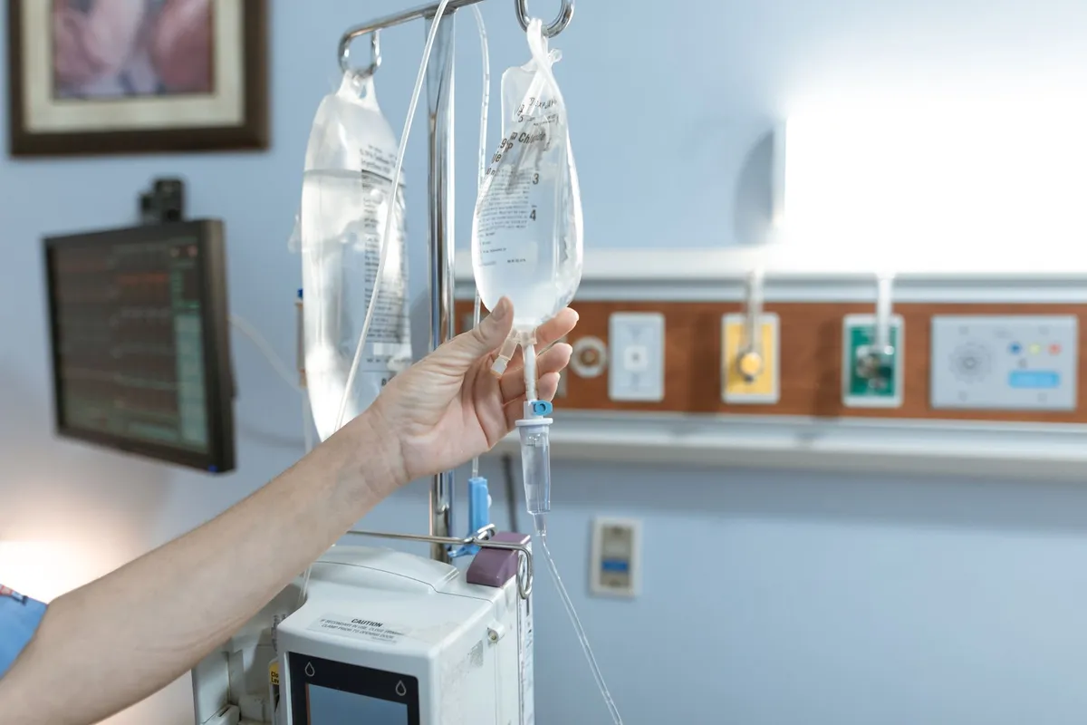 IV bag being prepared for chemotherapy treatment in a hospital setting.