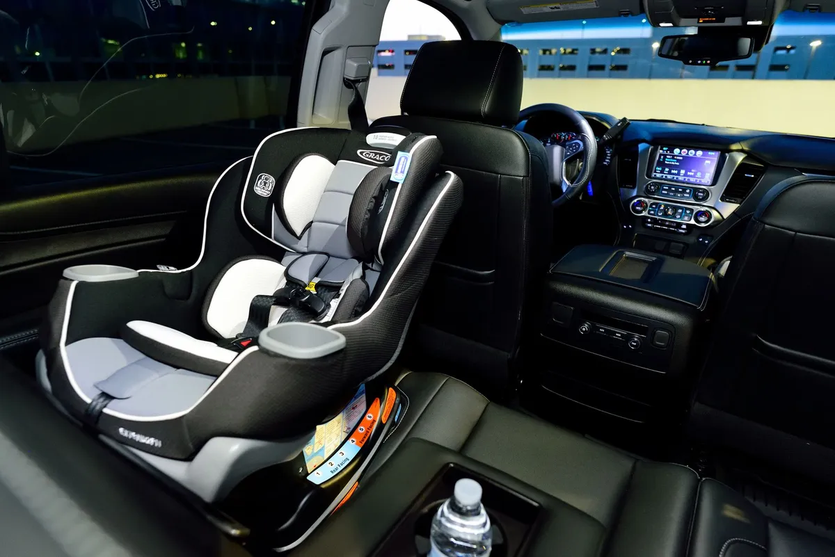 A car seat positioned in a vehicle, ready for child safety use.