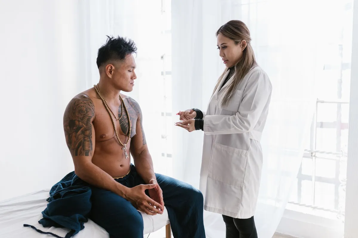 A healthcare provider discussing treatment options with a patient in a clinical setting.