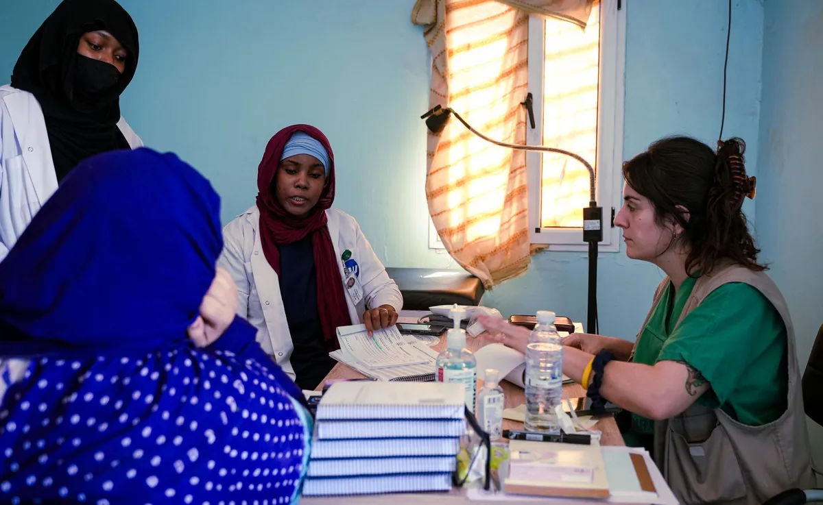 Healthcare professionals discussing in a clinical setting.