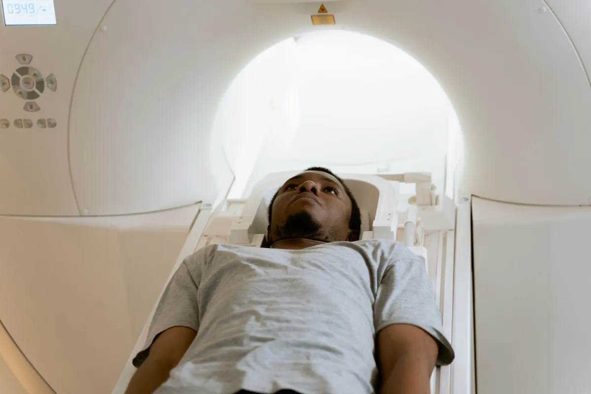 Patient lying on a CT scan table, preparing for the imaging procedure.